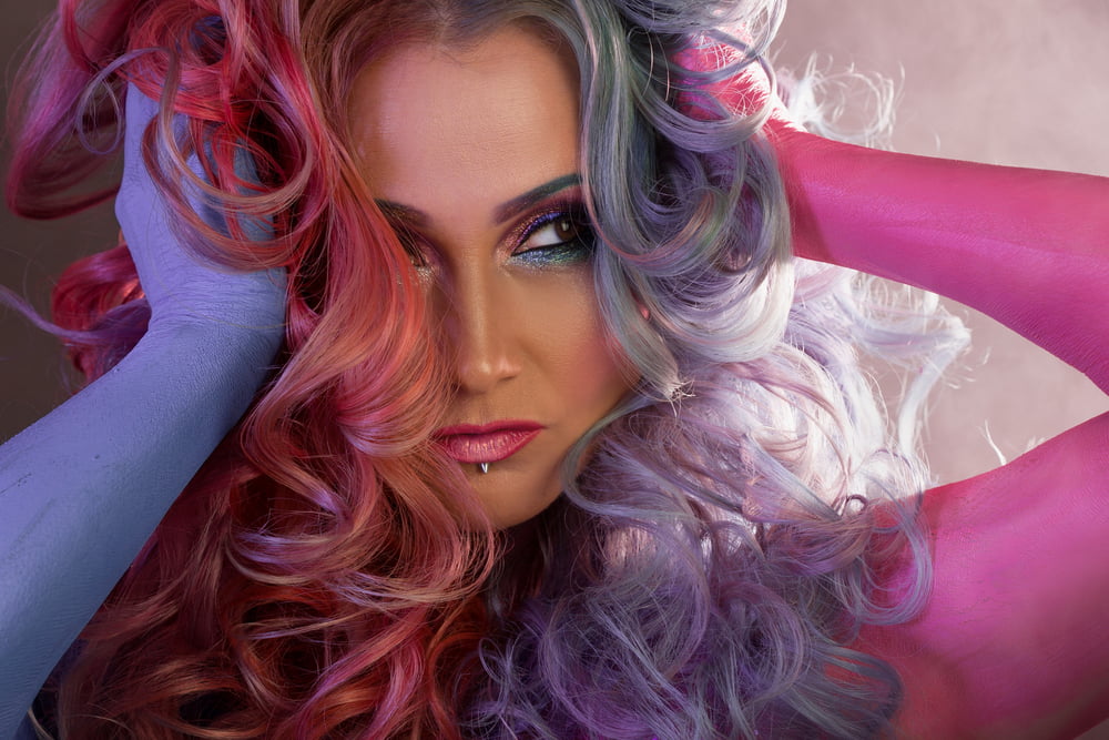 Beautiful Woman With Bright Hair. Body Painting And Bright Hair Coloring